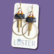 Load image into Gallery viewer, Pair of brass and stone earrings on a Luster branded card against a purple background