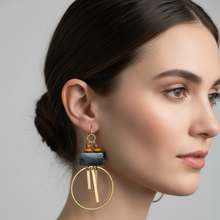 Load image into Gallery viewer, Earrings on a Luster branded card on a female