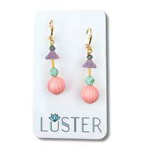 Load image into Gallery viewer, Pair of earrings with pink and green beads on a Luster branded card.
