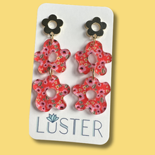 Load image into Gallery viewer, Floral earrings on a Luster branded card against a yellow background
