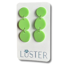 Load image into Gallery viewer, Green earrings on a Luster branded card against a white background
