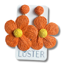 Load image into Gallery viewer, Orange flower-shaped earrings with yellow centers on a white card displaying the brand 'Luster'.
