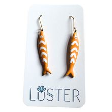Load image into Gallery viewer, Fish-shaped earrings on a Luster branded card
