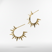 Load image into Gallery viewer, Gold spike earrings on a light gray background
