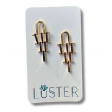 Load image into Gallery viewer, Gold brass earrings on a Luster branded card

