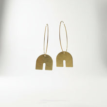 Load image into Gallery viewer, Pair of gold hoop earrings with arch-shaped pendants on a white background
