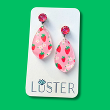 Load image into Gallery viewer, Pink teardrop earrings with strawberry pattern on a Luster branded card against a green background
